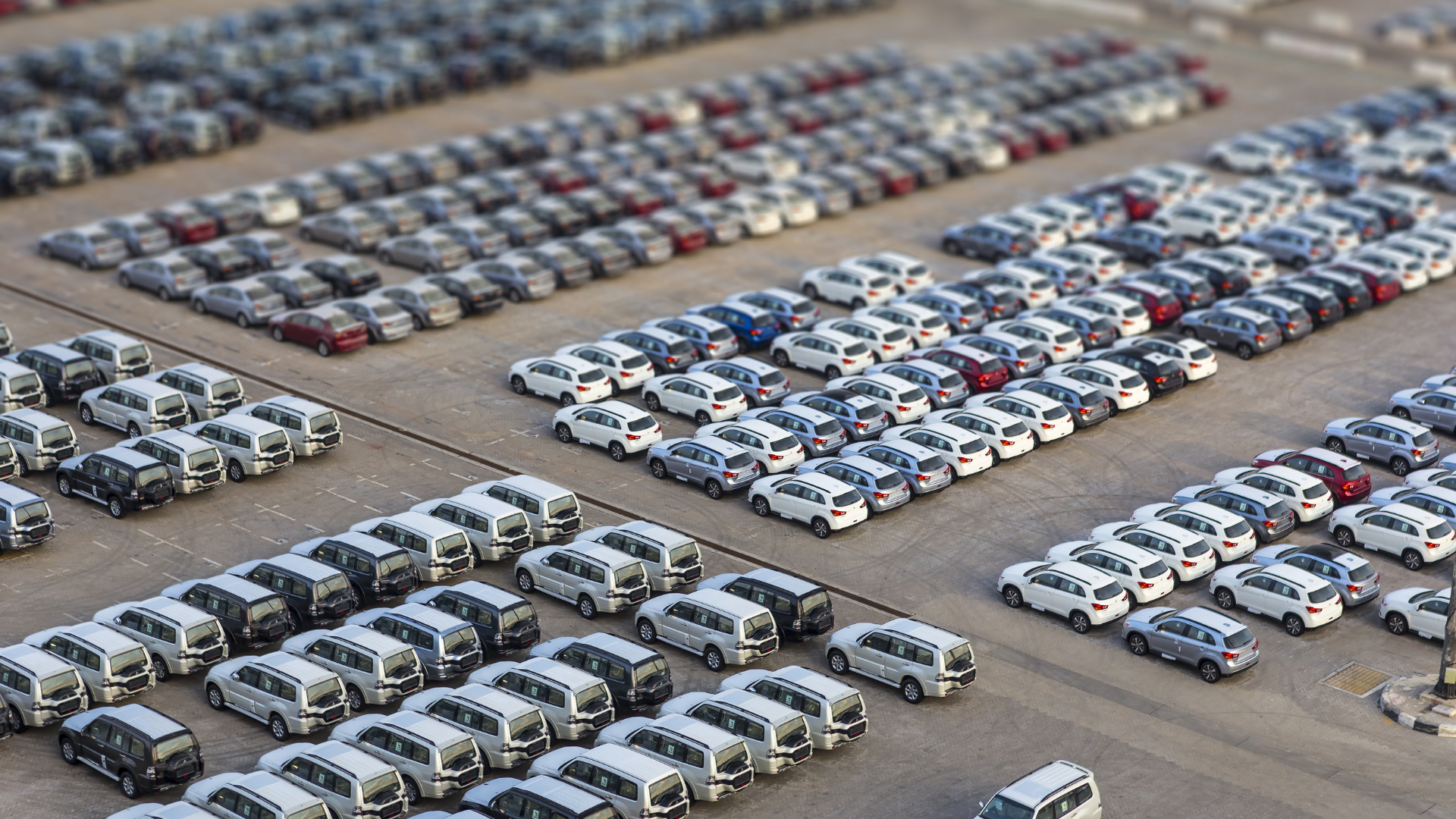 A parking lot full of fleet vehicles. 