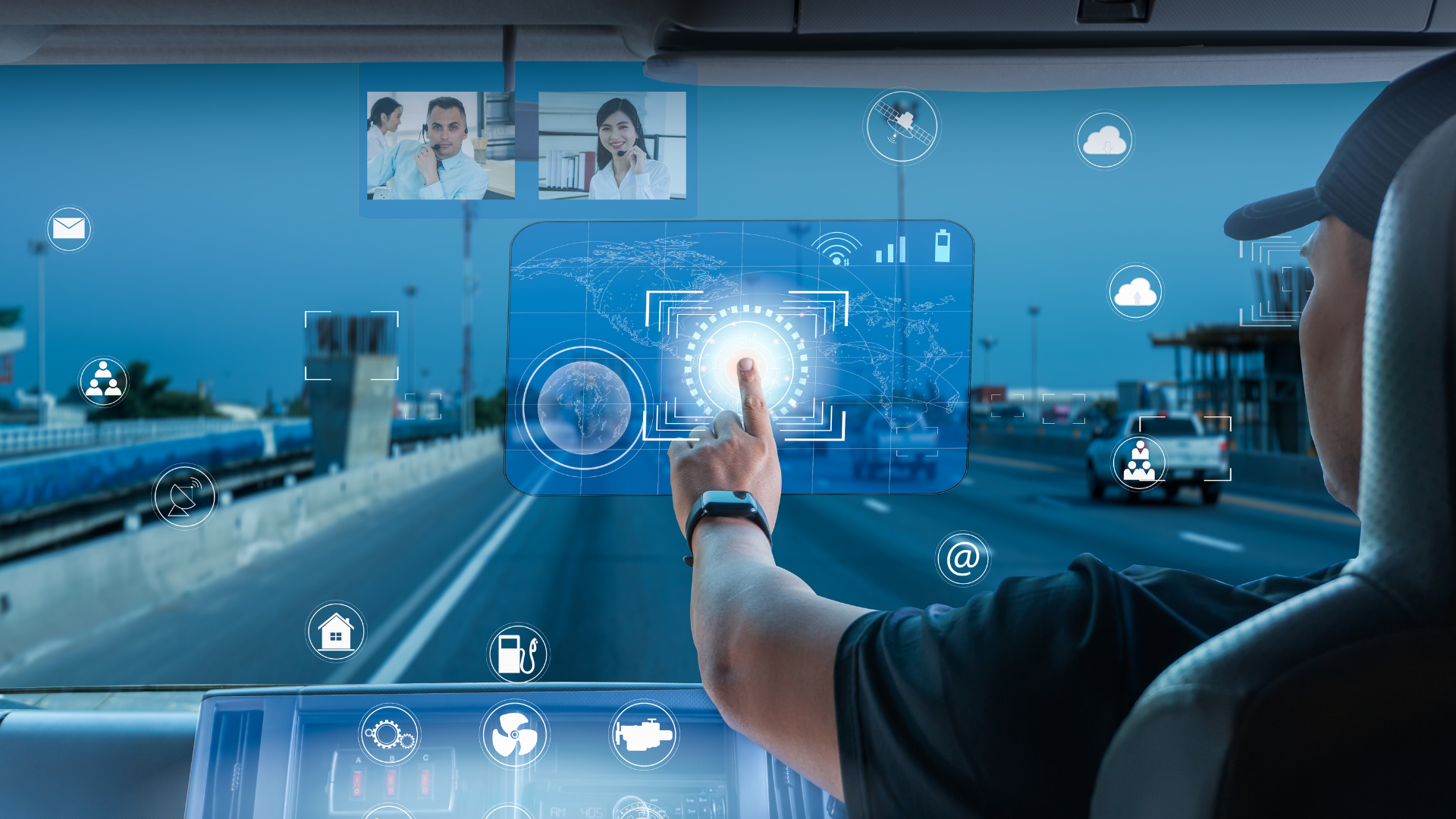 A truck driver using a digital touch screen displayed on his windshield. 